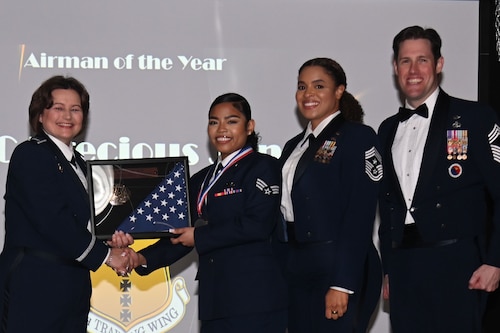 U.S. Air Force Col. Angelina Maguinness presents the Airman of the Year award to Senior Airman Precious Jones during the 2023 Annual Awards Ceremony at the First Financial Pavilion, San Angelo, Texas Feb. 24, 2024. This year’s guest speaker was U.S. Air Force Chief Master Sgt. Alex J. Eudy, Senior Non-Commissioned Officer Academy commandant. (U.S. Air Force photo by Airman James Salellas)