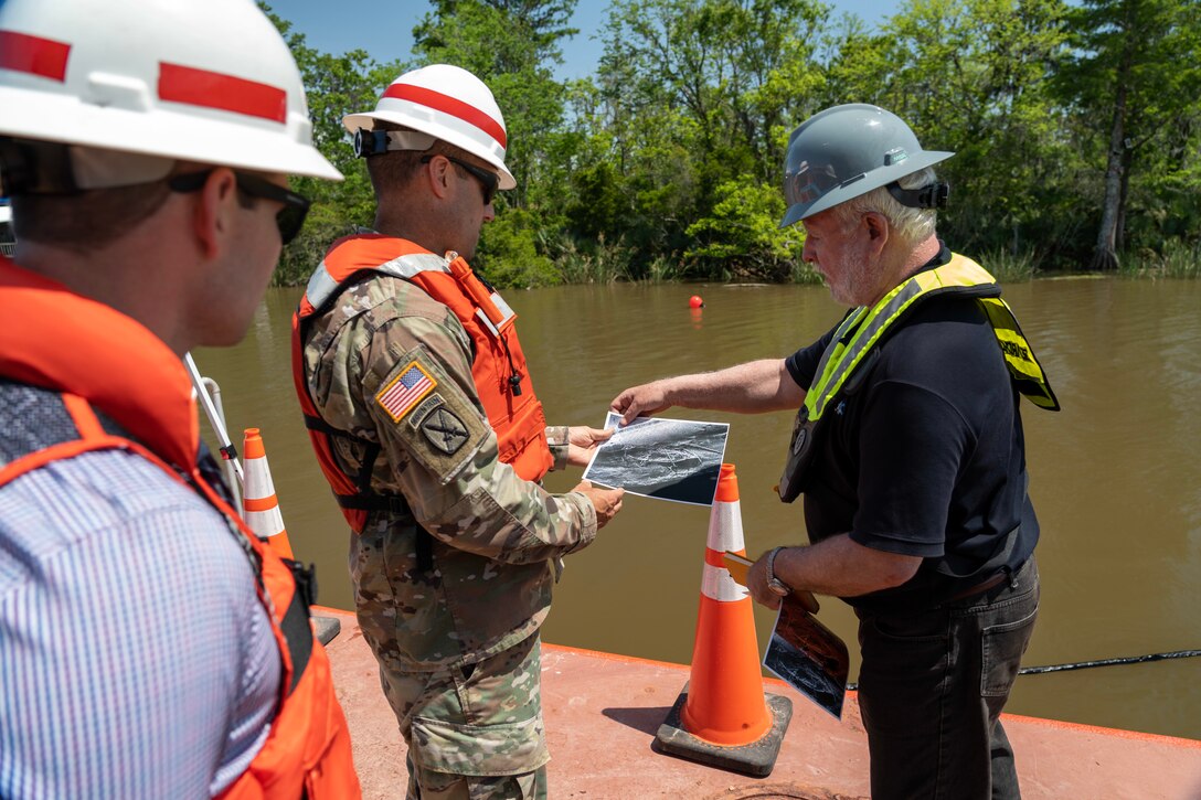 Col. Jeremy Chapman, Commander of the U.S. Army Corps of Engineers Mobile District, engages in discussions with members of the Regulatory Division, the Alabama Historical Commission, and various stakeholders aboard a survey vessel near the submerged Clotilda site in Mobile, Alabama, May 4, 2022. Collaborating closely with the AHC and other partners, the Mobile District is committed to locating and safeguarding the Clotilda, the final documented slave ship to traverse United States waters, intentionally sunk near Africatown after dropping off 110 captives to conceal this illegal operation. (Courtesy photo)