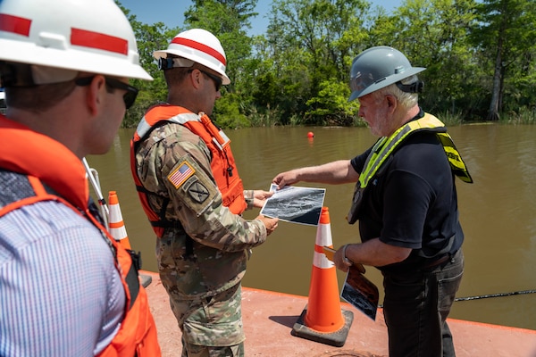Col. Jeremy Chapman, Commander of the U.S. Army Corps of Engineers Mobile District, engages in discussions with members of the Regulatory Division, the Alabama Historical Commission, and various stakeholders aboard a survey vessel near the submerged Clotilda site in Mobile, Alabama, May 4, 2022. Collaborating closely with the AHC and other partners, the Mobile District is committed to locating and safeguarding the Clotilda, the final documented slave ship to traverse United States waters, intentionally sunk near Africatown after dropping off 110 captives to conceal this illegal operation. (Courtesy photo)