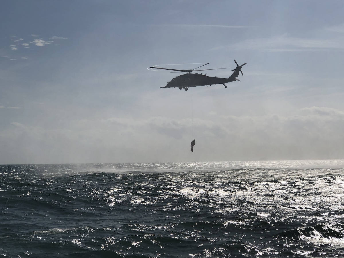 Airmen representing a team from Wright-Patterson Air Force Base in the 2019 Air Force Research Laboratory Commander’s Challenge participate in a search-and-rescue immersion exercise with the 920th Rescue Wing, Air Force Reserve Command, at Patrick Space Force Base, Fla., in summer 2020. The exercise required participants to play the roles of “downed pilots” from a helicopter to better understand the challenges of maritime combat search-and-rescue procedures. (Courtesy photo / Bon Strout)