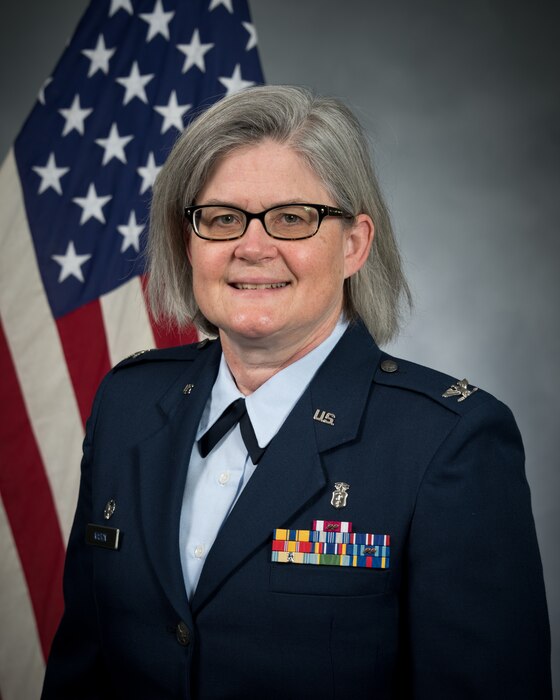 a woman poses for a bio photo