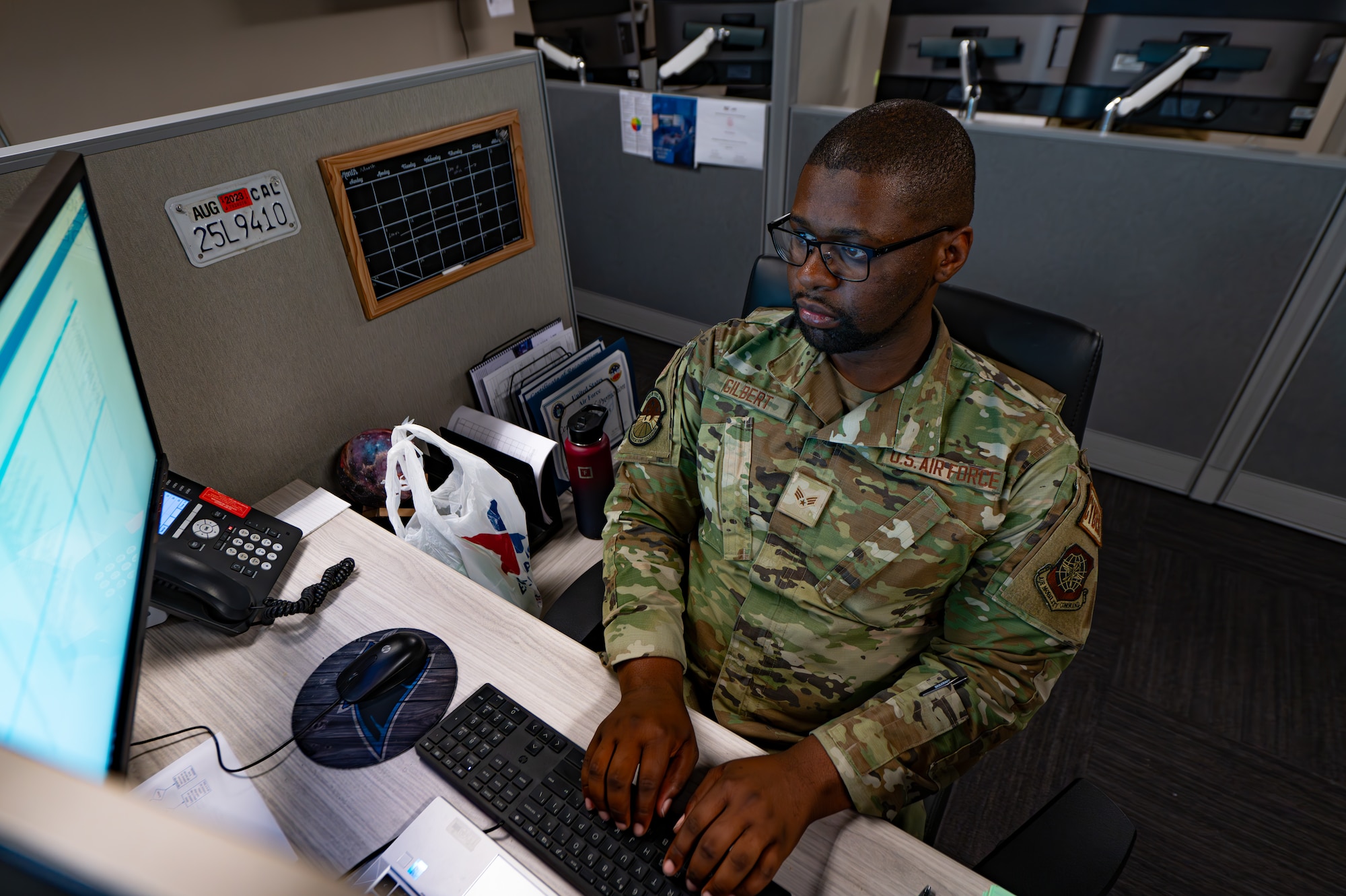 U.S. Air Force Senior Airman Jared Gilbert, a 6th Communications Squadron cyber readiness analyst, resolves trouble tickets at MacDill Air Force Base, Florida, Feb. 28, 2024.