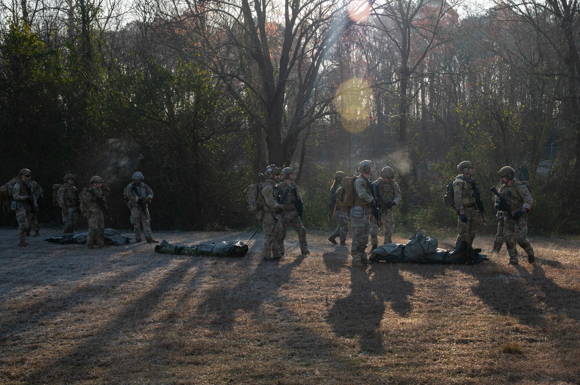 U.S. Airmen assigned to the 4th Civil Engineer Squadron transport mock personnel during a simulated response exercise at Seymour Johnson Air Force Base, North Carolina, Feb. 22, 2024. Over the course of the exercise, participants practiced recovering downed pilots, located sensitive components and transported high value explosive items while maintaining security in a simulated hostile environment. (U.S. Air Force Photo by Airman 1st Class Rebecca Sirimarco-Lang)