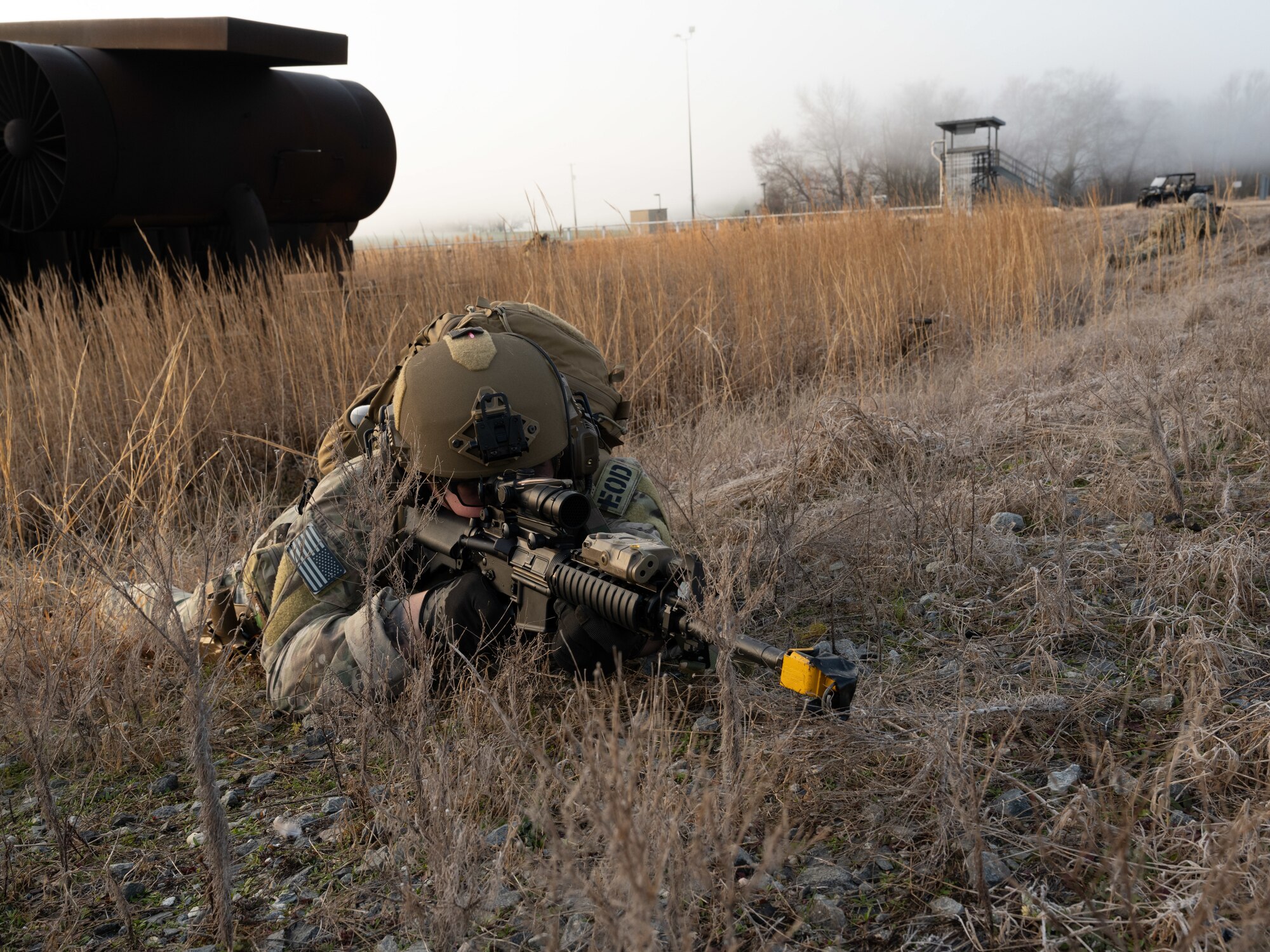 U.S. Air Force Senior Airman Cameron Jennings, an explosive ordnance disposal team member assigned to the 4th Civil Engineer Squadron, defends a position during a simulated response exercise at Seymour Johnson Air Force Base, North Carolina, Feb. 22, 2024. The training tested the squadron’s ability to properly respond to an aircraft crash under strenuous conditions and brought several different organizations across base together to maximize the training experience. (U.S. Air Force Photo by Airman Rebecca Tierney)