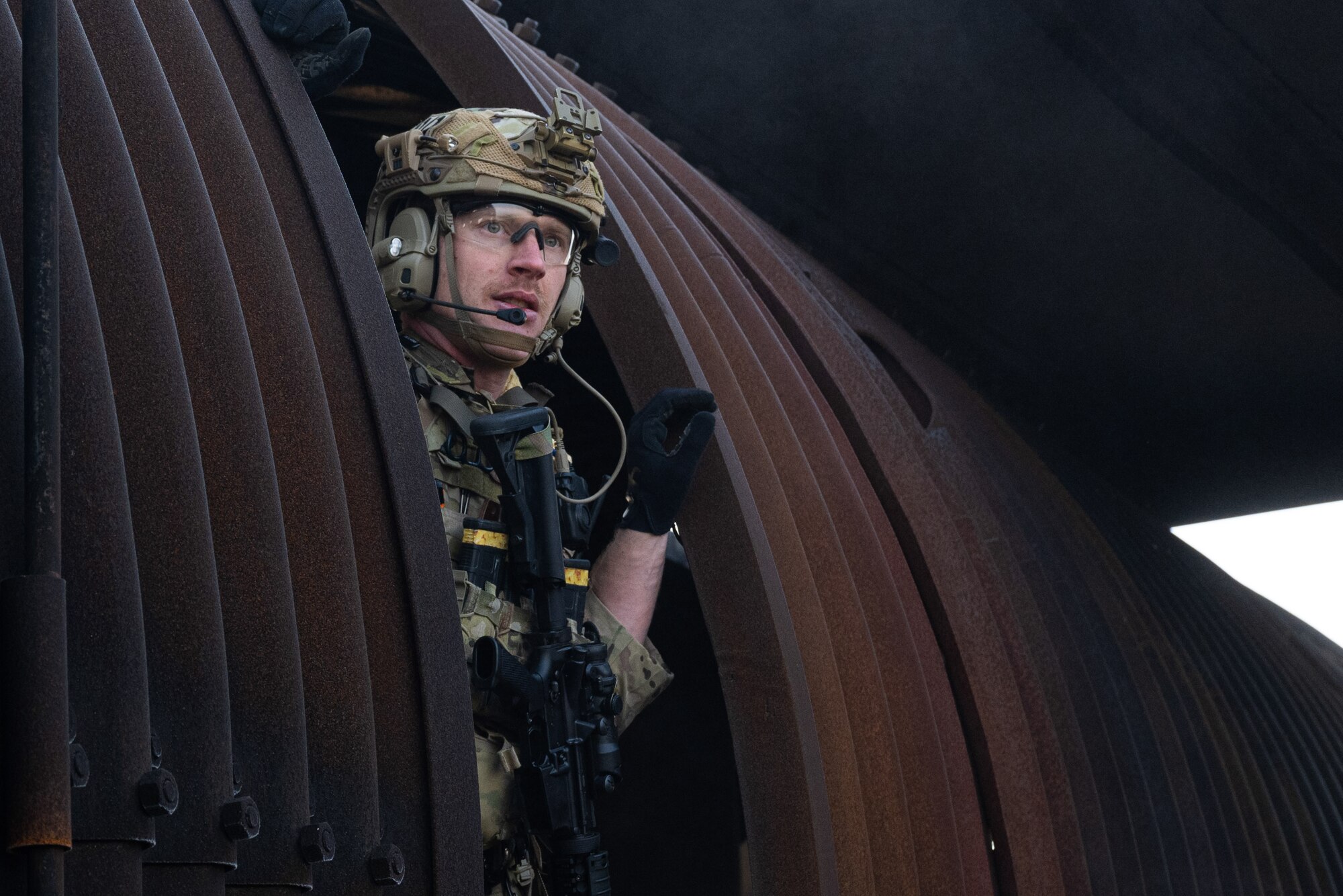 U.S. Air Force Technical Sgt. Daniel Giansanti, an explosive ordnance disposal team leader assigned to the 4th Civil Engineer Squadron, performs a sweep of a downed aircraft during a simulated response exercise at Seymour Johnson Air Force Base, North Carolina, Feb. 22, 2024. Over the course of the exercise, participants practiced recovering downed pilots, located sensitive components and transported high value explosive items while maintaining security in a simulated hostile environment. (U.S. Air Force Photo by Airman Rebecca Tierney)