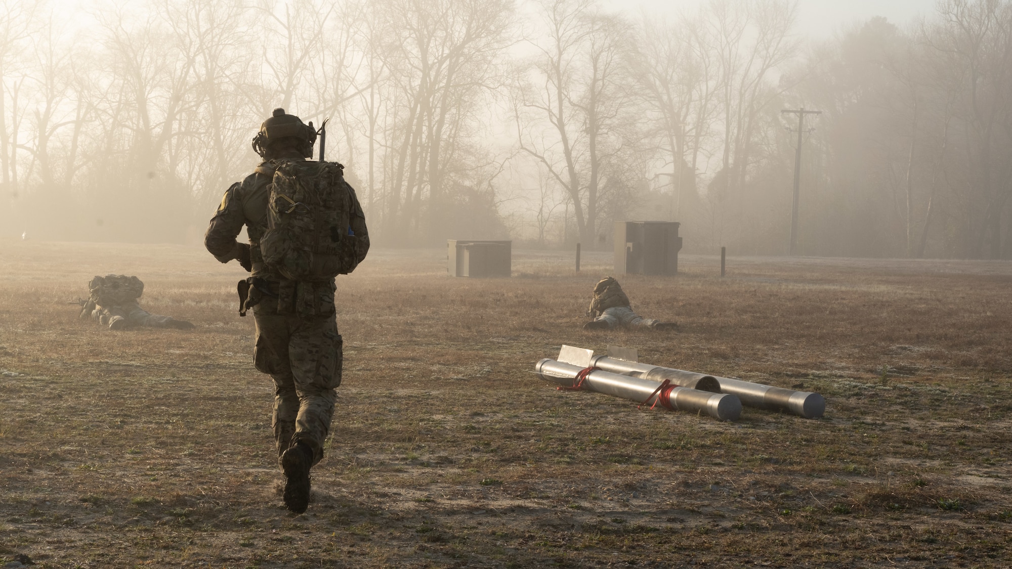 U.S. Air Force Staff Sgt. Gabriel Parini, an explosive ordnance disposal team lead assigned to the 4th Civil Engineer Squadron, conducts tactical maneuvers during a simulated response exercise at Seymour Johnson Air Force Base, North Carolina, Feb. 22, 2024. Over the course of the exercise, participants practiced recovering downed pilots, located sensitive components and transported high value explosive items while maintaining security in a hostile environment. (U.S. Air Force Photo by Airman Rebecca Tierney)