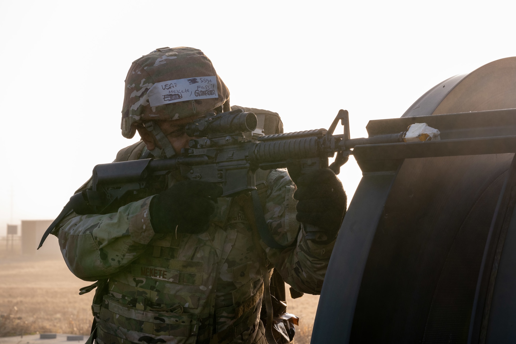 U.S. Air Force Staff Sgt. Fassil Mekete, non-commissioned officer in charge of material control assigned to the 4th Civil Engineer Squadron, aims an M4 carbine during a simulated response exercise at Seymour Johnson Air Force Base, North Carolina, Feb. 22, 2024. The training tested the squadron’s ability to properly respond to an aircraft crash under strenuous conditions and brought several different organizations across base together to maximize a realistic atmosphere and maintain security. (U.S. Air Force Photo by Airman Rebecca Tierney)