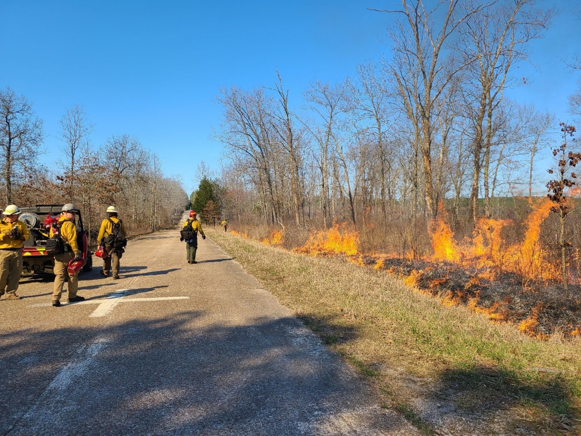 Crews monitor a previous prescribed fire, or controlled burn, at Arnold Air Force Base, Tennessee, in spring 2021. This spring, the Natural Resources Management team at Arnold will conduct prescribed fires across Arnold. Prescribed fire allows land managers to alter and improve the native ecosystems without utilizing more costly methods such as mulching, mowing and herbicide applications. (Courtesy photo)