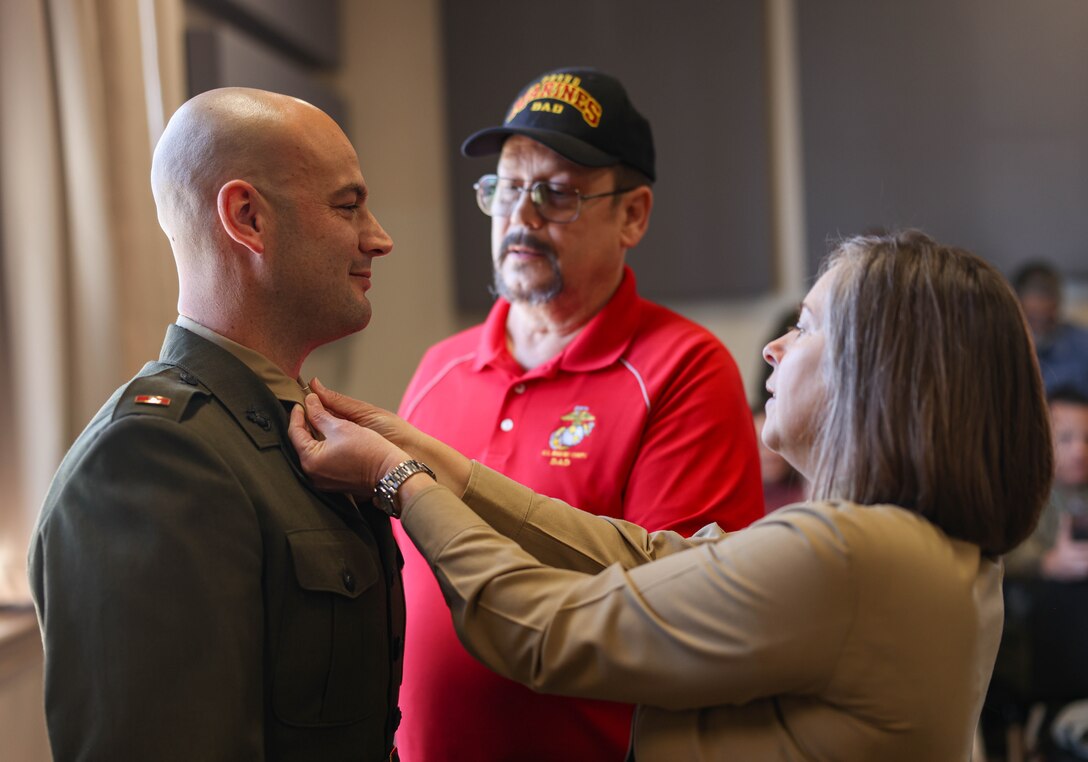 U.S. Marine Corps Warrant Officer Benjamin Hallquist, an Owasso, Oklahoma native, a student with Headquarters and Service Battalion, Marine Corps Recruiting Depot San Diego, California, gets pinned to the rank of warrant officer during the Marine Corps Band Pinning and Leadership Ceremony on Marine Corps Base Quantico, Virginia, Feb. 1, 2024. The ceremony was held to honor four Marines getting promoted to the rank of warrant officer and recognize them for their accomplishments. (U.S. Marine Corps photo by Lance Cpl. David Brandes)