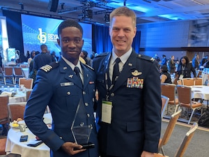 U.S. Air Force Academy Cadet Jabari Bowen poses with Col. Joshua Egan, head of the USAFA Electrical and Computer Engineering Department, after receiving the Student Leadership - Undergraduate Level Award during the 2024 Black Engineer of the Year awards ceremony in Baltimore, Md., Feb. 17, 2024. The prestigious honor celebrates Bowen's outstanding contributions to leadership, academics and service within the science, technology, engineering and mathematics fields. (U.S. Air Force courtesy photo)