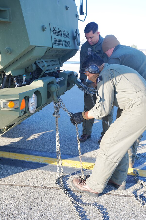 U.S. Marines with Fox Battery, 2nd Battalion, 14th Marine Regiment, 4th Marine Division, Marine Forces Reserve and Marine Aerial Refueler Transport Squadron (VMGR) 234, Marine Aircraft Group 41, 4th Marine Aircraft Wing, Marine Forces Reserve begin onloading a M142 High Mobility Artillery Rocket System (HIMARS) onto a C-130J Hercules during a HIMARS Rapid Infiltration, also known as a HIRAIN, during exercise Arctic Edge 2024 (AE24) at Eielson Air Force, Alaska, Feb. 24, 2024. The HIRAIN training demonstrated Marine Forces Reserve’s ability to rapidly deploy the HIMARS to meet and deter any threats in any environment, including harsh arctic environments. AE24 is a U.S. Northern Command-led homeland defense exercise demonstrating the U.S. military’s capabilities in extreme cold weather, joint force readiness, and U.S. military commitment to mutual strategic security interests in the arctic region. (U.S. Marine Corps photo by Maj. Jeremy A. Wheeler)