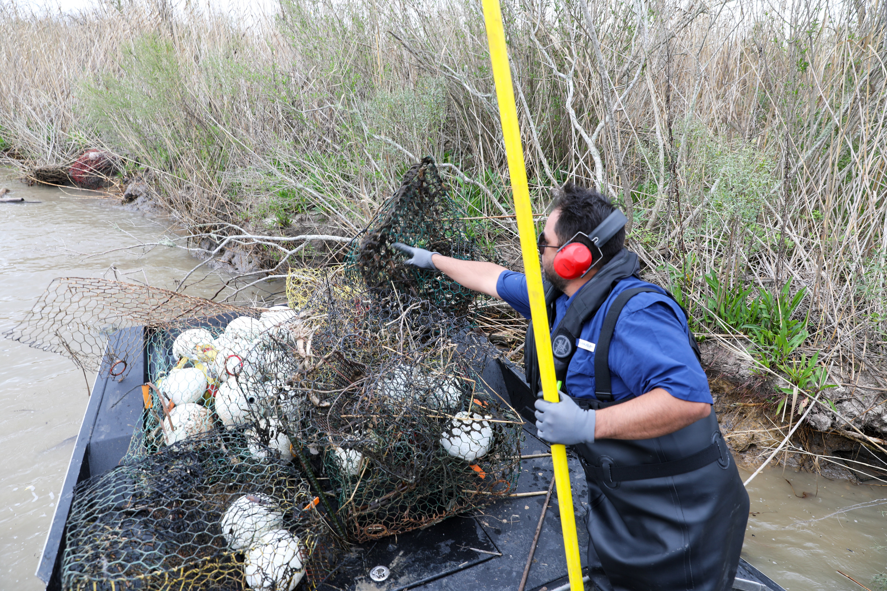 Wallisville Lake Project staff clean up abandoned crab traps