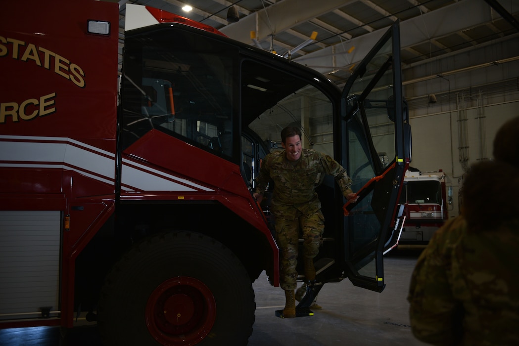 U.S. Air Force Chief Master Sgt. Alex J. Eudy, Senior Non-Commissioned Officer Academy commandant, climbs out of a Rosenbauer Panther firetruck at Goodfellow Air Force Base, Texas, Feb. 22, 2024. The Louis F. Garland Department of Defense Fire Academy has a fleet of fire trucks with different equipment and firefighting capabilities. (U.S. Air Force photo by 2nd Lt. Kayunna Holt)
