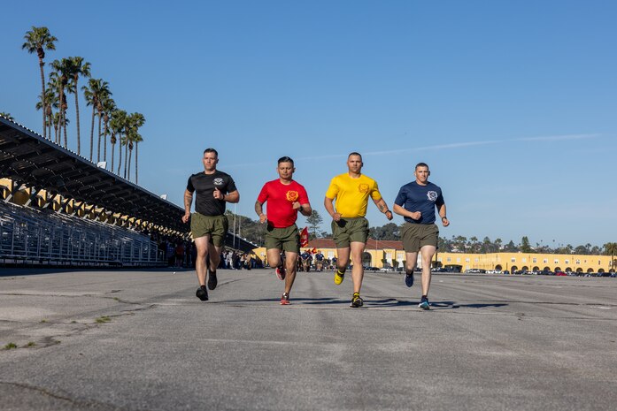 U.S. Marine Corps drill masters with Recruit Training Regiment, lead the motivational run for the new Marines of India Company, 3rd Recruit Training Battalion, at Marine Corps Recruit Depot San Diego, Feb. 22, 2024. The company motivational run is the last physical training event the Marines will conduct before they graduate from MCRD San Diego. (U.S. Marine Corps photo by Cpl. Joshua M. Dreher)