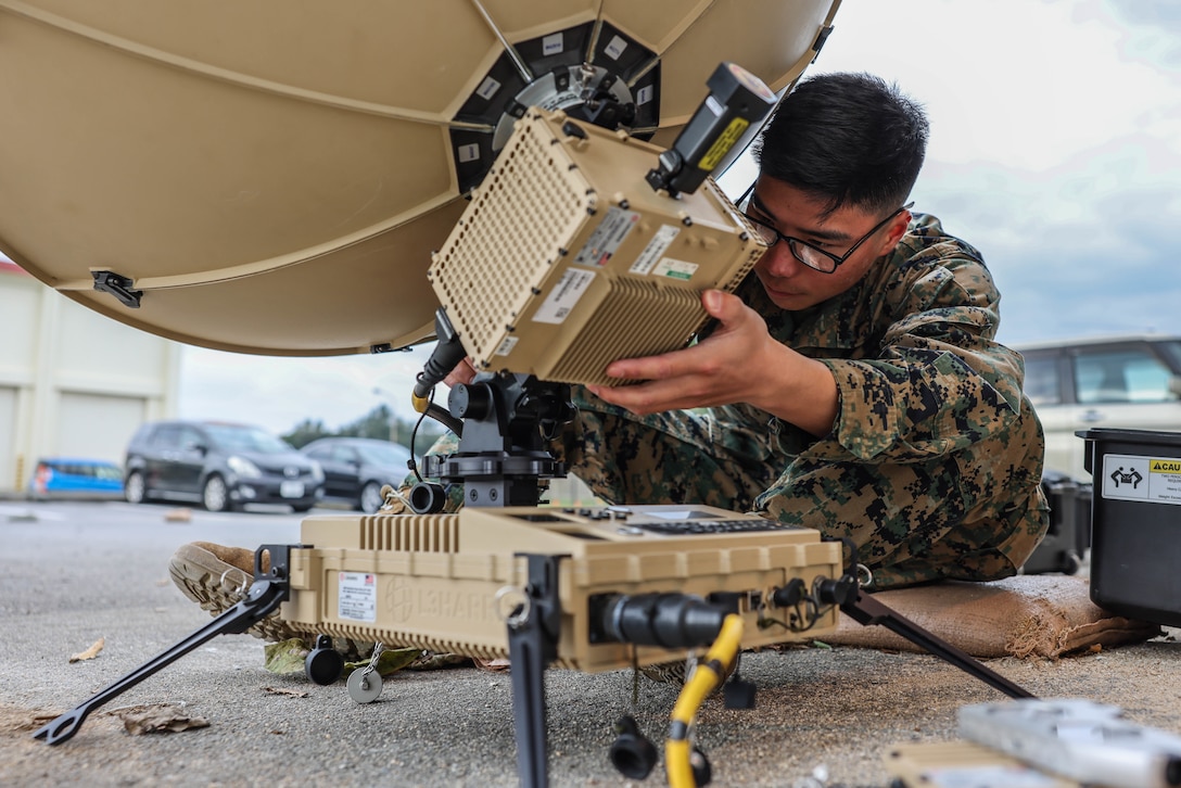 U.S. Marine Corps Pfc. Henry Li, a satellite transmission system operator with 7th Communication Battalion, III Marine Expeditionary Force Information Group, conducts gear checks in preparation for a platoon field exercise on Camp Hansen, Okinawa, Japan, Jan. 30, 2023. The purpose of the platoon field exercise is to maintain proficiency with communication equipment. III MIG functions as the vanguard of III MEF, operating in the Indo-Pacific regions information environment, and supports Marine Air Ground Task Force operations with communications, intelligence, and supporting arms liaison capabilities. (U.S. Marine Corps photo by Cpl. Grace Gerlach)