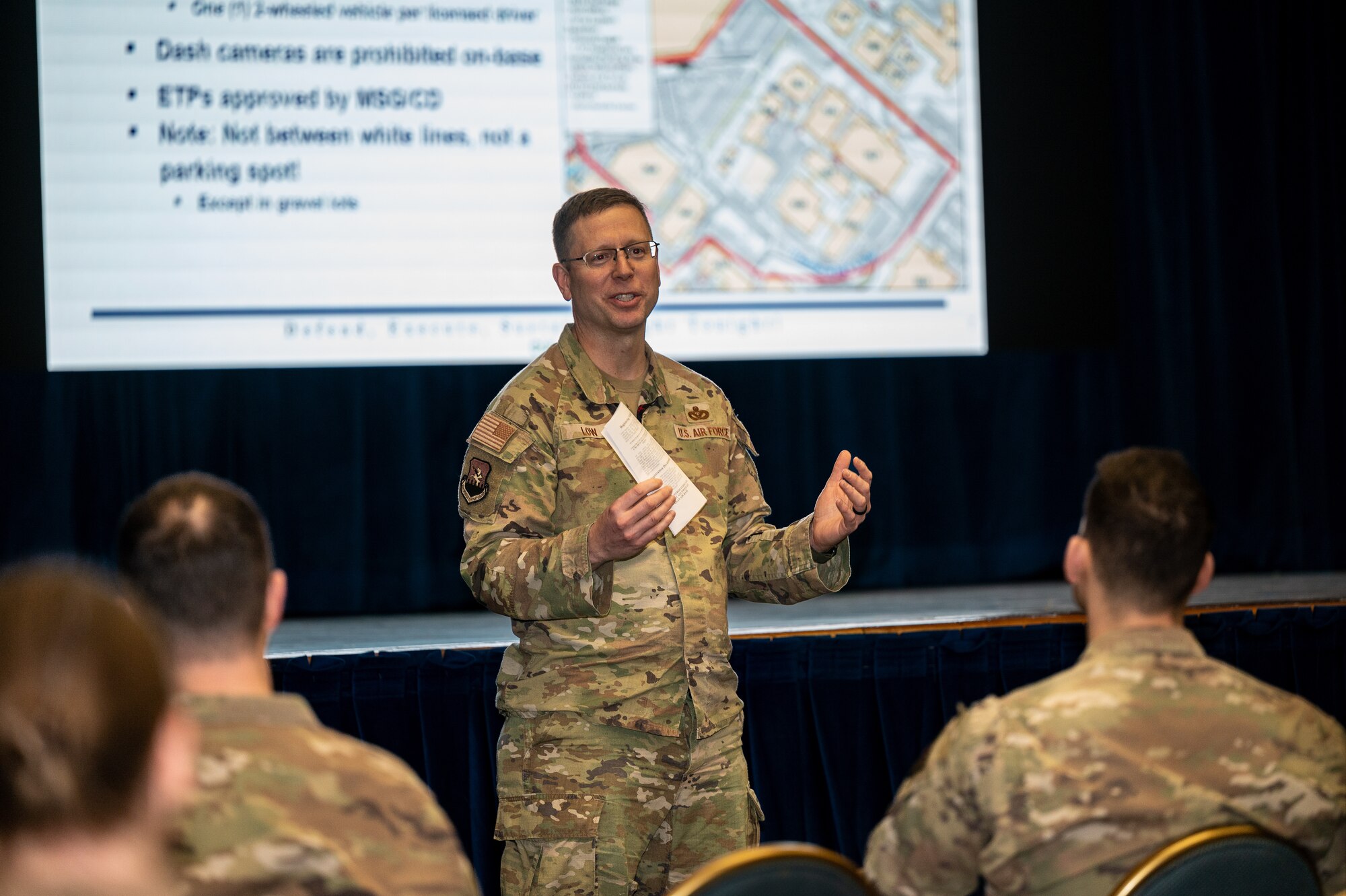 U.S. Air Force Lt. Col. Brian Low, 51st Mission Support Group deputy commander, briefs new parking measures during a town hall at Osan Air Base, Republic of Korea, Feb. 15, 2024. The town hall was a part of the 51st Fighter Wing’s new Communication Action Plan. As part of the plan, Osan will hold monthly town halls to foster open dialogue, address concerns and keep the base community well-informed about ongoing developments and initiatives. (U.S. Air Force photo by Staff Sgt. Thomas Sjoberg)