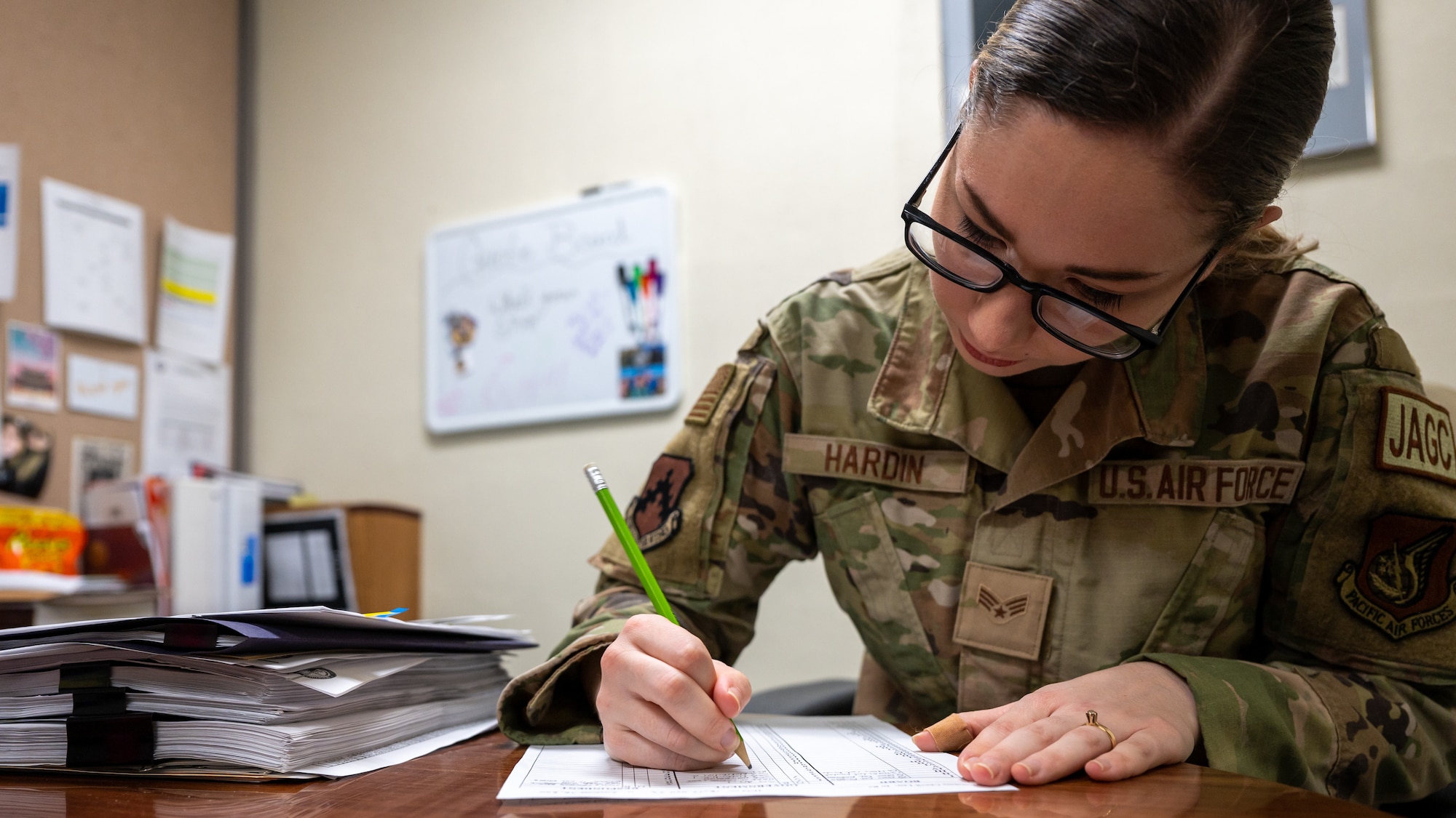 Senior Airman Erin Hardin prepares legal documents.
