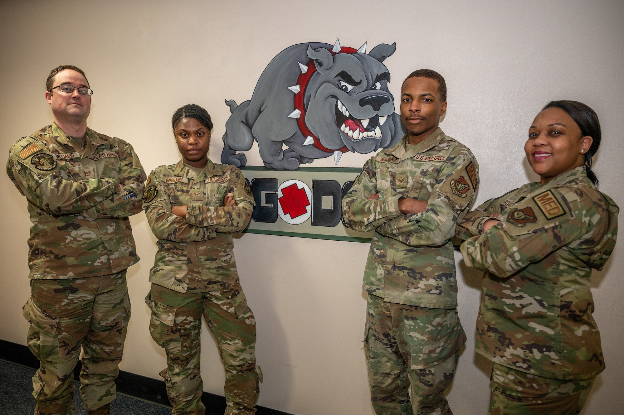 U.S. Air Force Chief Master Sgt. Vanessa Arthur, 354th Medical Group Senior Enlisted Leader, poses with Airmen from the 354th MDG team on Eielson Air Force Base, Alaska, Feb. 27, 2024.