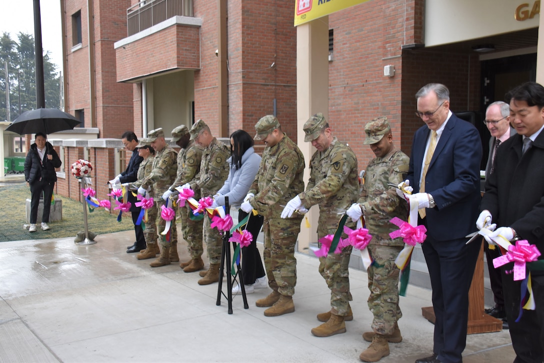 Representatives from the 19th Expeditionary Sustainment Command, 8th Army, U.S. Army Corps of Engineers – Far East District, U.S. Army Garrison – Daegu and the first family to live in a new housing tower cut the ribbon on the facility in a ceremony at Camp Walker, South Korea, on Feb. 29, 2024.
