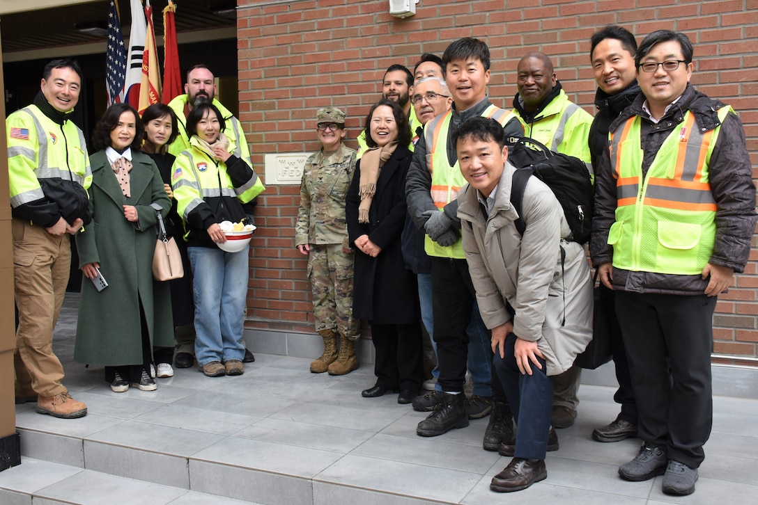 Some of the members of the project delivery team at the U.S. Army Corps of Engineers – Far East District who worked to complete the fourth and final housing tower on Camp Walker after a ribbon cutting ceremony marking its official opening on Feb. 29, 2024.