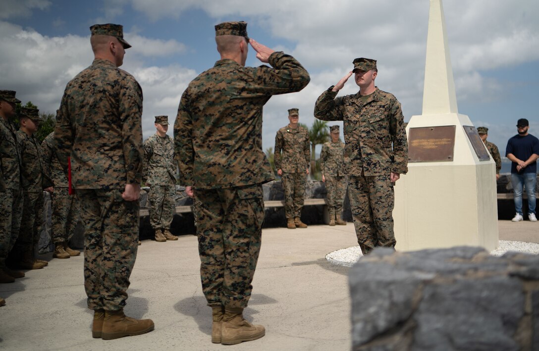 U.S. Marine Corps Lance Cpl. Kaydan N. Smith reenlists during a ceremony at the Iceberg Memorial on Camp Courtney, Okinawa, Japan Feb. 21, 2024. Smith said he reenlisted for the Marines around him and for the stability the military provides. “This is my family away from my family,” said Smith. Marines who are eligible for reenlistment demonstrate dedication to duty, professionalism, and leadership ability. Smith, native of Hays, Kansas, is a network administrator with Headquarters Battalion, 3d Marine Division, Okinawa, Japan. (U.S. Marine Corps photo by Staff Sgt. Albert Carls)