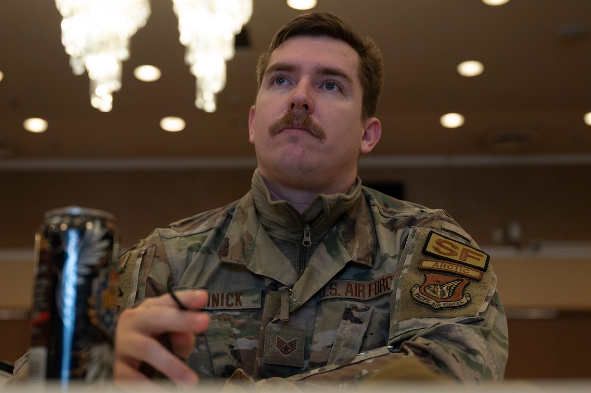 A U.S. Airman from the 35th Security Forces Squadron takes notes during the F-35 Emergency Response Symposium at Misawa Air Base, Japan, Feb. 21, 2024.