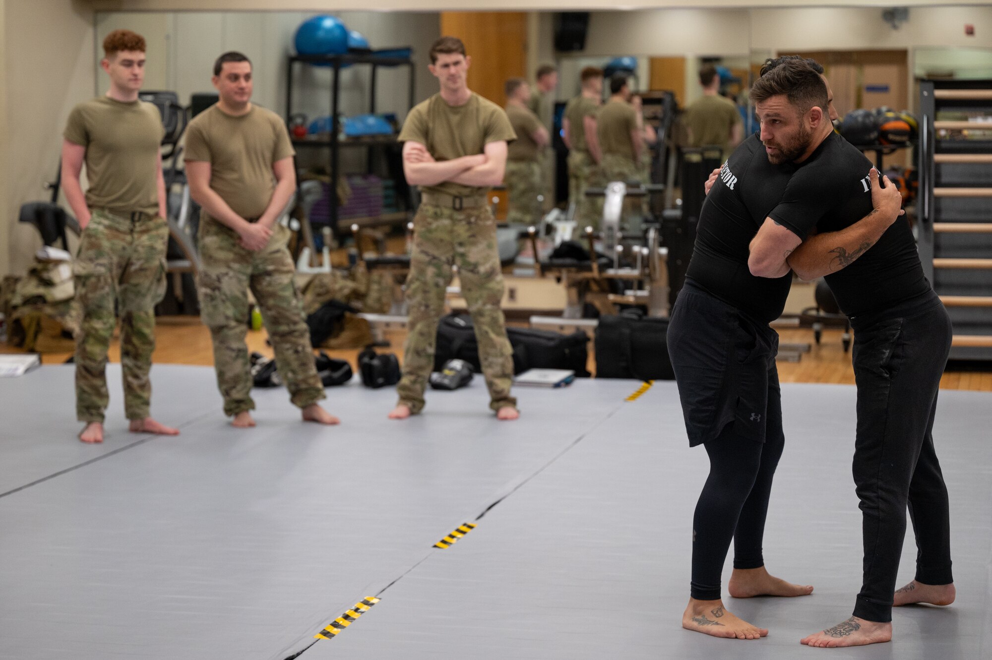 U.S. Air Force combatives instructors from the 5th Combat Communications Support Squadron teach steps for handling an opponent during a combatives instructor certification course at Osan Air Base, Republic of Korea, Feb. 23, 2024. Airmen that participated in the course become multi-capable as they are now certified to instruct Air Force personnel in combative tactics. The 621st Air Control Squadron and 607th Air Operations Center intend to utilize the new certifications to tailor a combatives program to their operational needs and enhance their ability to support the 51st Fighter Wing’s combat lethality. (U.S. Air Force photo by Airman 1st Class Chase Verzaal)