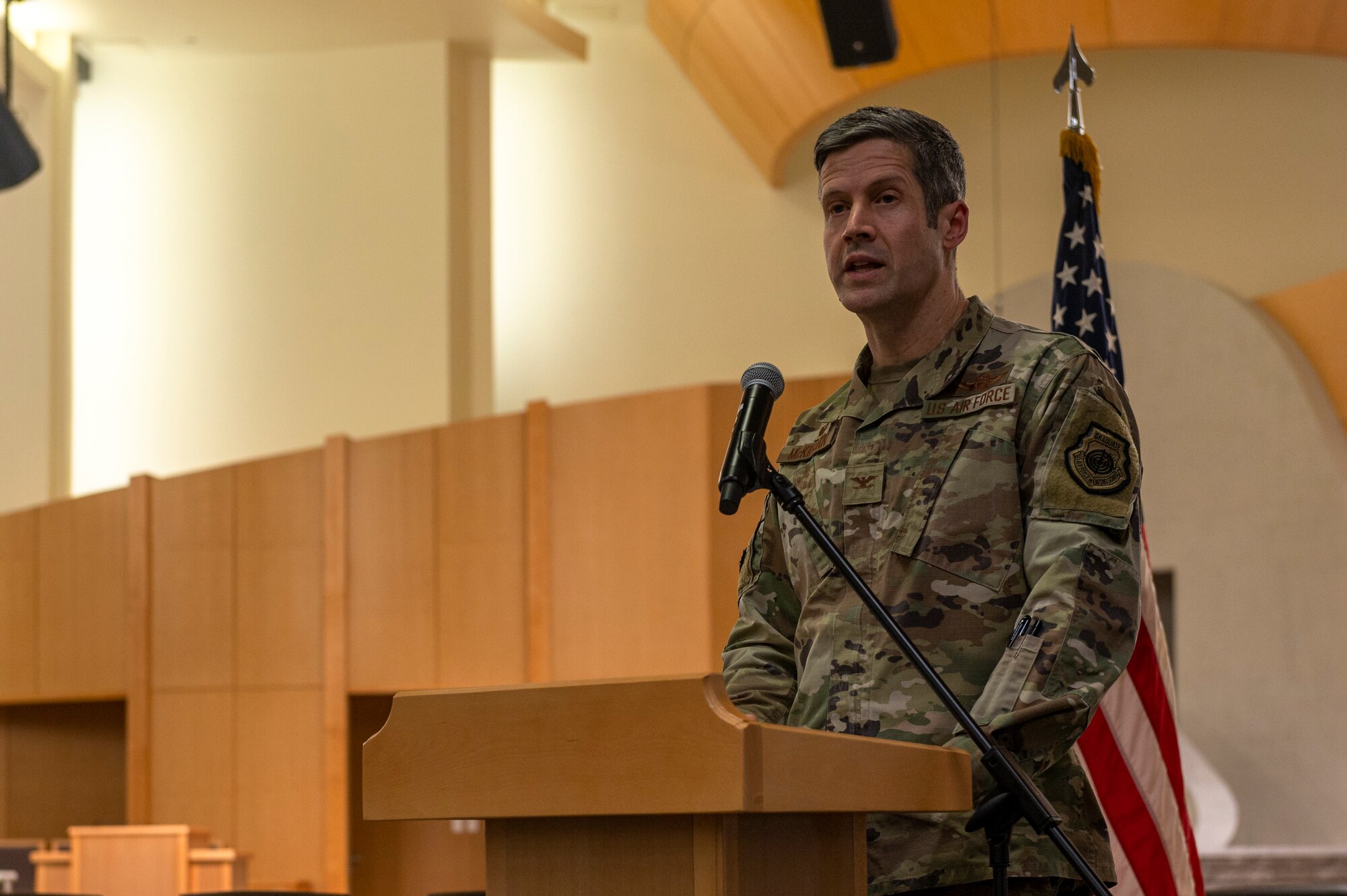 U.S. Air Force Col. William McKibban, 51st Fighter Wing commander, gives remarks during the Osan Air Base Chapel Grand Opening Ceremony at Osan AB, Republic of Korea, Feb. 29, 2024. The previous chapel was built in 1973 and served about 7,000 members per month. The new complex provides a 300-person worship center for multi-faith religious services, a reception hall, classrooms and administrative spaces at the installation. The new chapel commits to maintaining its service to Airmen for the next 50 years, demonstrating an investment in Osan today for the Airmen of tomorrow. (U.S. Air Force photo by Senior Airman Kaitlin Castillo)