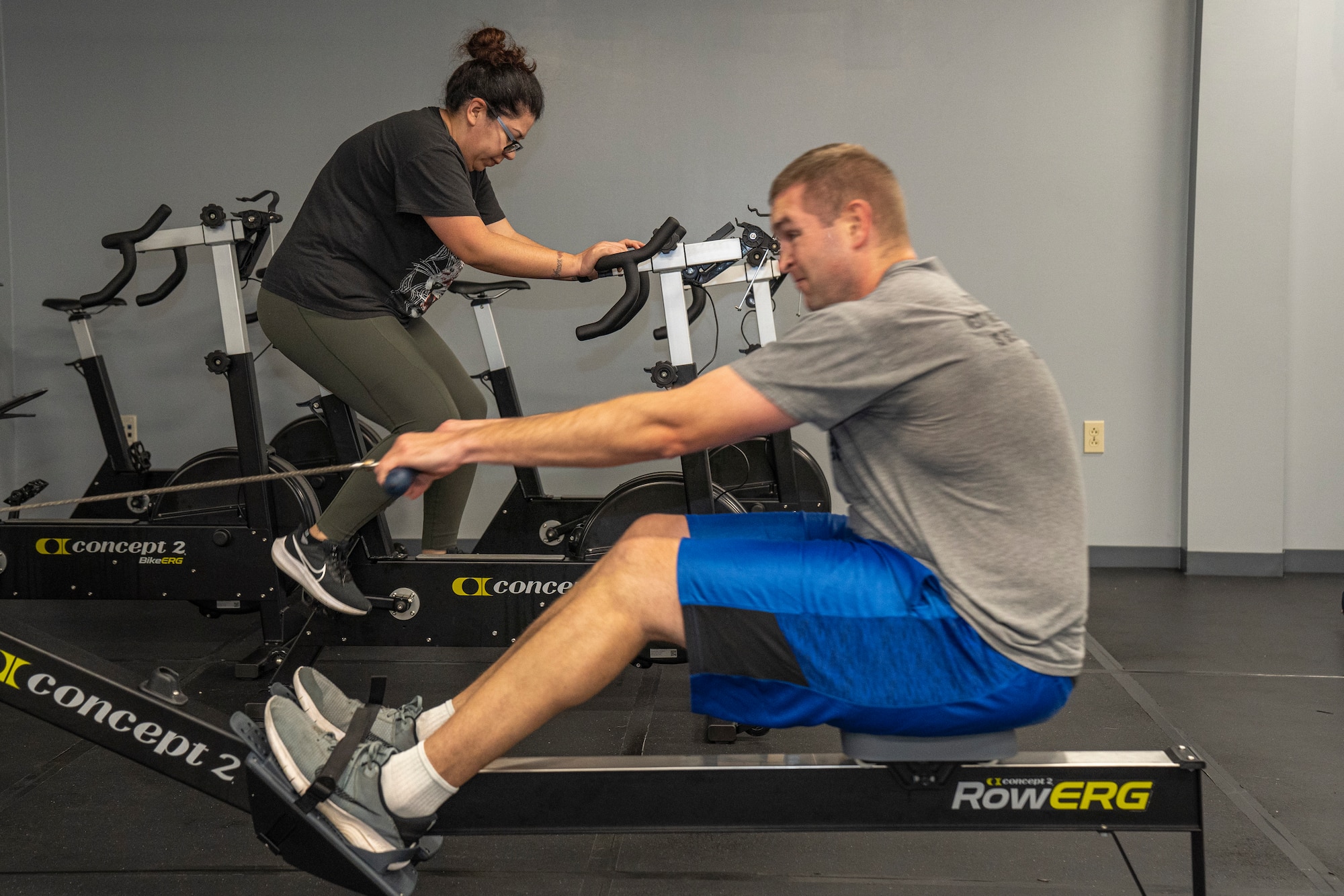 U.S. Air Force Master Sgt. Michael Day, 335th Training Squadron military training leader, and Master Sgt. Tiffany Barrios, 333rd Training Squadron MTL, perform exercises at the Human Performance Building on Keesler Air Force Base, Mississippi, Jan. 25, 2024.
