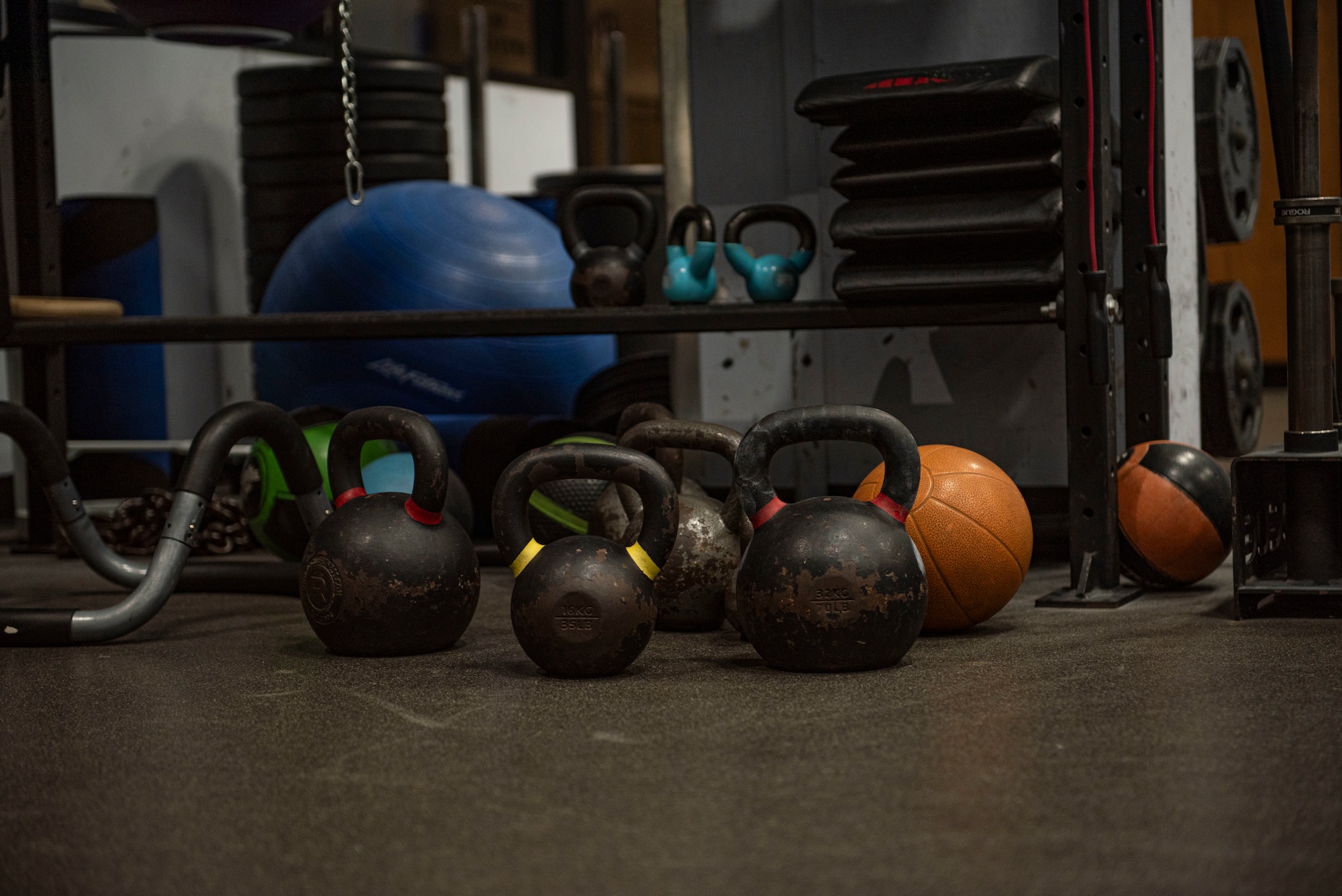 Weights sit on the floor at the gym