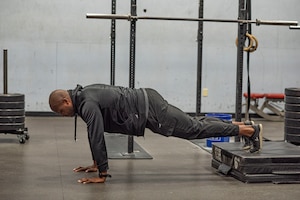 A coach shows the correct form for a workout