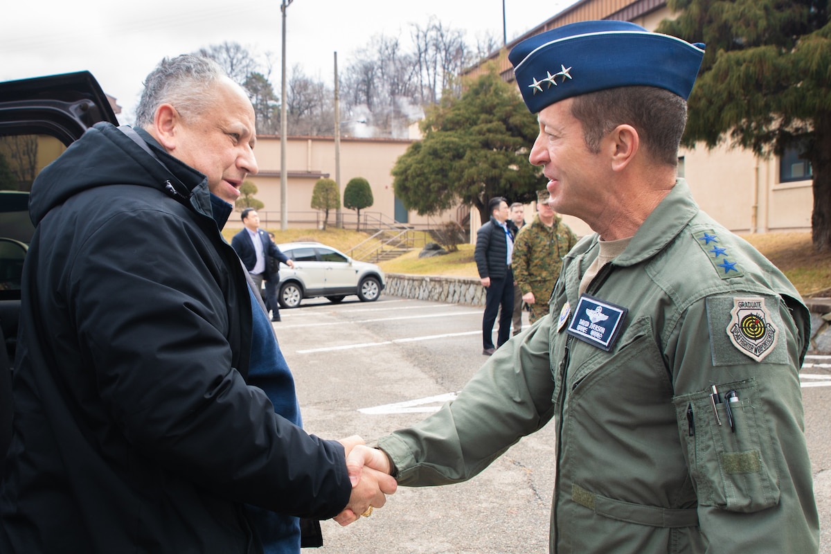 U.S. Air Force Lt. Gen. David R. Iverson, Deputy Commander, U.S. Forces Korea; Commander, Air Component Command, United Nations Command; Commander, Combined Air Component Command, Combined Forces Command; and Commander, 7th Air Force, right, greets Carlos Del Toro, Secretary of the Navy, during a visit to Osan Air Base, Feb. 25, 2024.