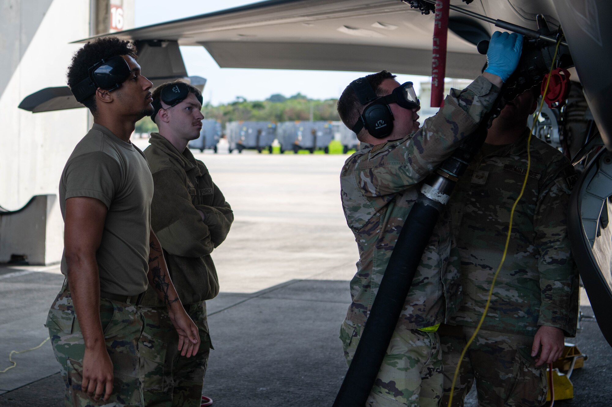 Four Airmen conduct refueling operations