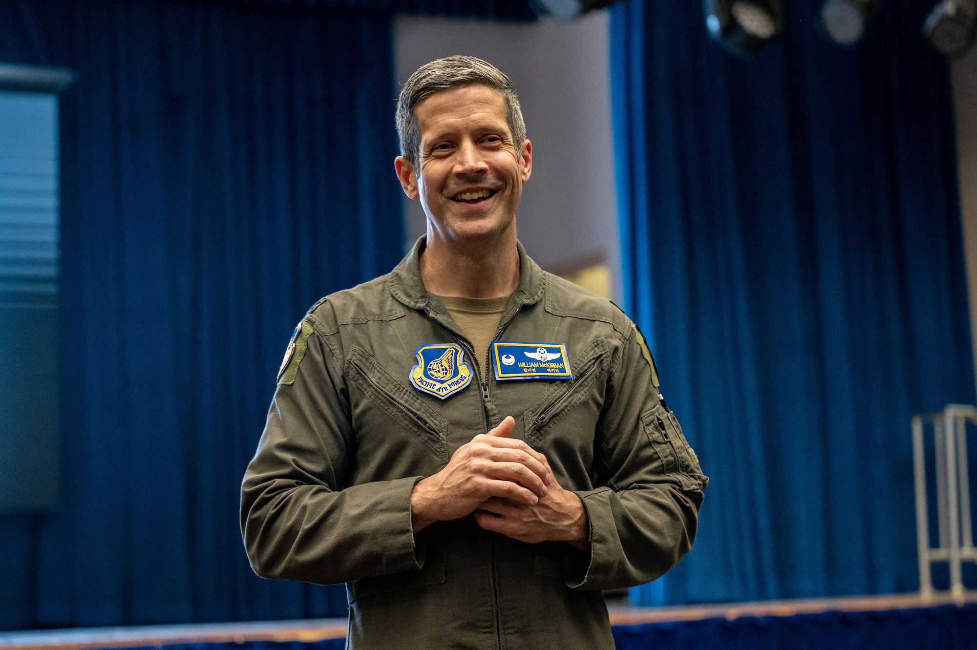 U.S. Air Force Col. William McKibban, 51st Fighter Wing commander, briefs the new Communication Action Plan during a town hall at Osan Air Base, Republic of Korea, Feb. 15, 2024. The plan lays out a robust framework aimed at enriching the 'Osan Experience' by building trust through consistent and clear messaging from the moment Airmen and their families are notified of their assignment until their departure. (U.S. Air Force photo by Staff Sgt. Thomas Sjoberg)