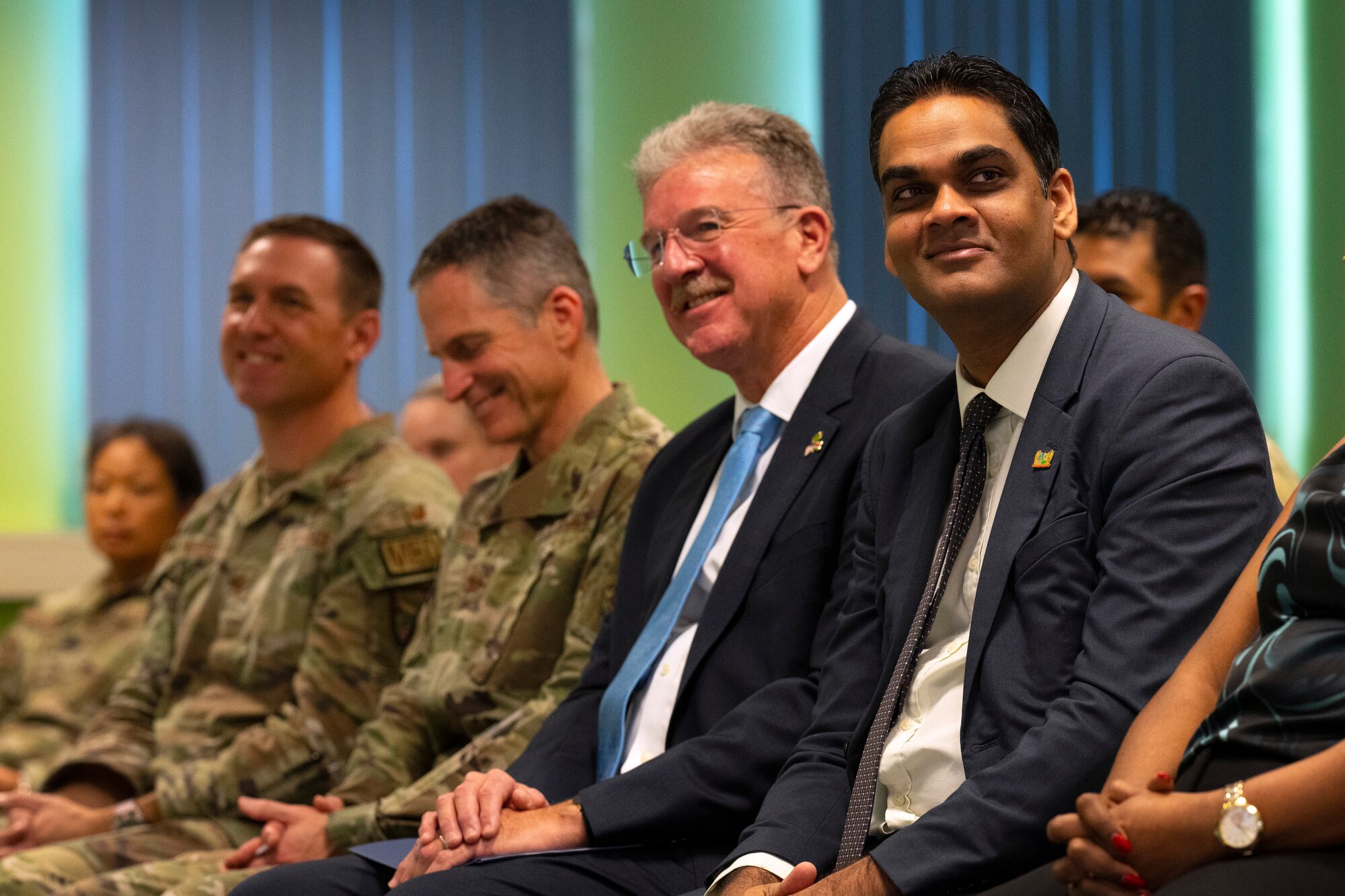 Dr. Amar Ramadhin, Suriname minister of health, right, sits beside Robert Faucher, U.S. Ambassador to Suriname, center, during a closing ceremony for the Lesser Antilles Medical Assistance Team mission at the Academic Hospital in Suriname, Feb. 28, 2024. The LAMAT mission seeks to strengthen U.S. partnerships within Latin America and the Caribbean region by providing relief to overwhelmed medical facilities through collaboration with host nation medical practitioners and respective Ministry of Health officials. (U.S. Air Force photo by Tech. Sgt. Rachel Maxwell)