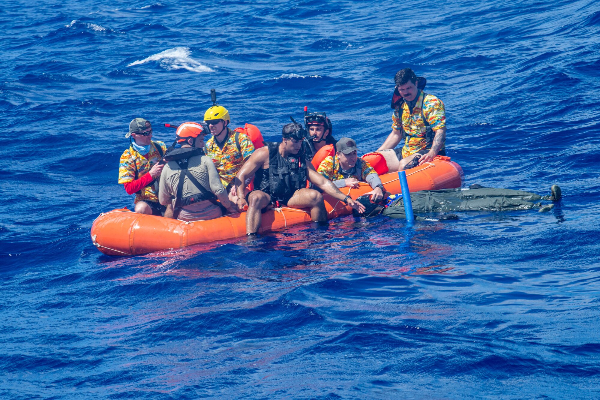 U.S. Air Force survival, evasion, resistance and escape specialists assigned to the 353rd Special Training Squadron and U.S. Navy naval air crewmen assigned to the Helicopter Sea Combat Squadron 25 conduct simulated survivor training during Cope North 24 off the coast of Guam Feb. 20, 2024 using the Science and Engineer Demand Force Team-built dummy. PACAF and our Joint and multinational partners are routinely exercising and training from various locations, demonstrating our collective ability to deploy airpower throughout the Pacific. (U.S. Air Force photo by Senior Airman Cedrique Oldaker)