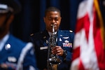 Space Forces-Space financial management division chief, expressively plays the saxophone during a retirement ceremony at Vandenberg Space Force Base.