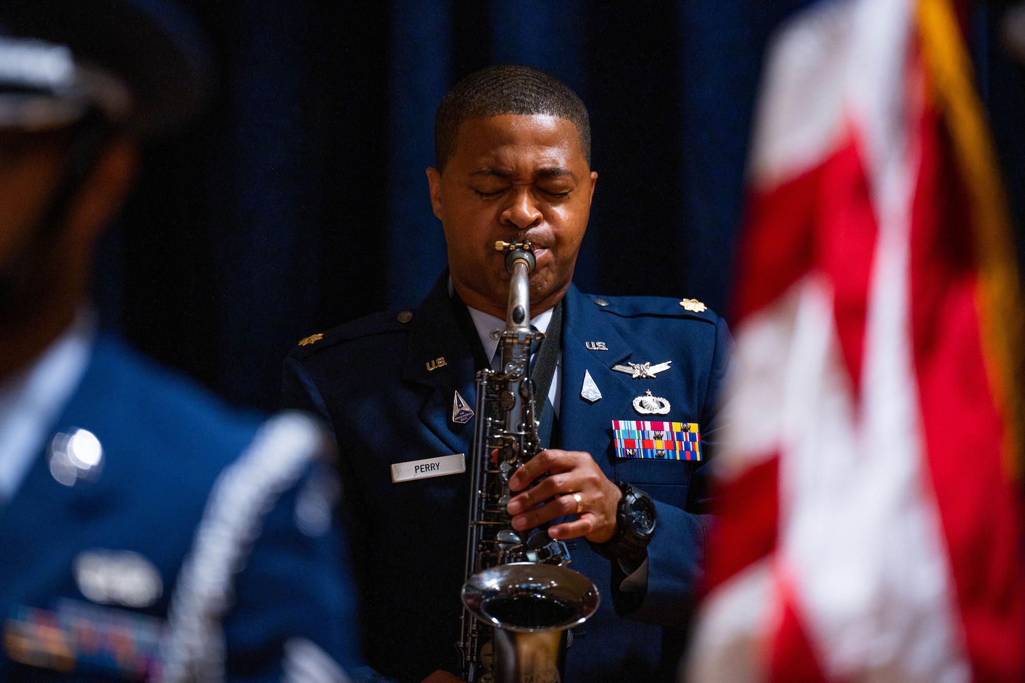 Space Forces-Space financial management division chief, expressively plays the saxophone during a retirement ceremony at Vandenberg Space Force Base.