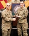 2nd Lt. Audrey Parios, right, of the Kentucky Air National Guard’s 123rd Maintenance Group, receives the National Guard Association of Kentucky’s Service Award from Col. George Imorde, association president, during the organization’s annual conference in Bowling Green, Ky., Feb. 3, 2024. During the Kentucky National Guard’s response to the COVID-19 pandemic, Parios worked seamlessly with military and civilian counterparts to provide more than 53,000 hours of non-clinical services, freeing medical providers to execute crucial patient care. (U.S. Army National Guard photo by Maj. Michael Reinersman)