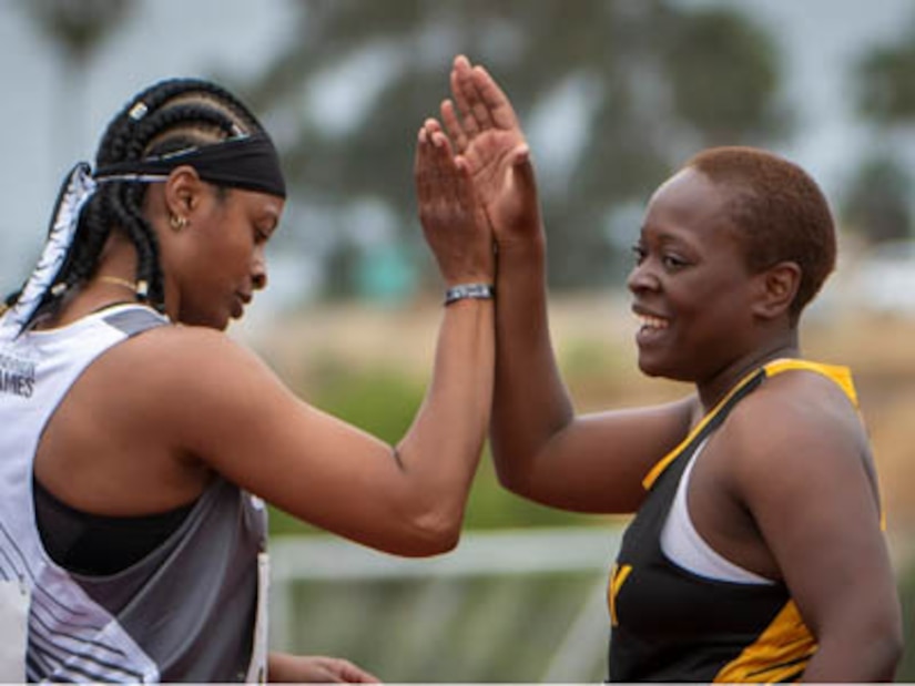 Photo By Petty Officer 1st Class George Bell | Sgt. 1st Class Dawn Page, Team SOCOM, and Sgt. Kaylin McClendon, Team Army, celebrate after a track event during the 2023 Department of Defense Warrior Games, June 6, 2023. The DoD Warrior Games Challenge is comprised of over 200 wounded, ill and injured service members and veteran athletes, competing in 11 adaptive sporting events June 2-12, 2023, at Naval Air Station North Island in San Diego, Calif. (U.S. Navy photo by Mass Communication Specialist 1st Class George M. Bell)