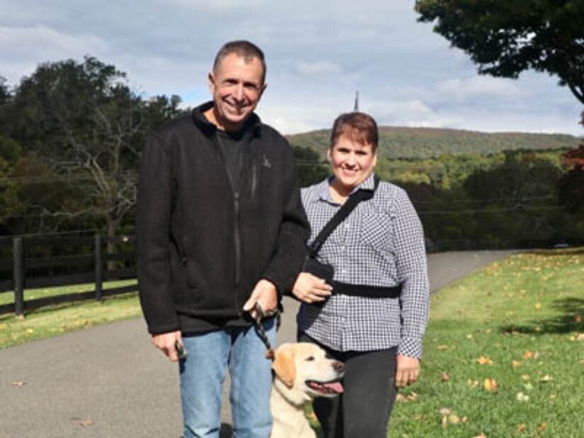 Courtesy Photo | (Photo courtesy Sgt. 1st Class Brett Hartley) Sgt. 1st Class Brett Hartley, his wife, Christine, and Wrigley.