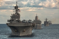 Ships from the Gerald R. Ford Carrier Strike Group (GRFCSG) and the Bataan Amphibious Ready Group (ARG), and Hellenic Navy frigate HS Navarinon (F 461) sail in formation in the Mediterranean Sea, Dec. 31, 2023. The ships from the GRFCSG include the first-in-class aircraft carrier USS Gerald R. Ford (CVN 78) and the Arleigh Burke-class guided-missile USS The Sullivans (DDG 68), USS Bulkeley (DDG 84), and USS Delbert D. Black (DDG 119). The ships from the Bataan ARG include the Wasp-class amphibious assault ship USS Bataan (LHD 5), the San Antonio-class amphibious transport dock USS Mesa Verde (LPD 19), and the Harpers Ferry-class dock landing ship USS Carter Hall (LSD 50). The U.S. maintains forward deployed, ready, and postured forces to deter aggression and support security and stability around the world. (U.S. Navy photo by Mass Communication Specialist 2nd Class Nolan Pennington)