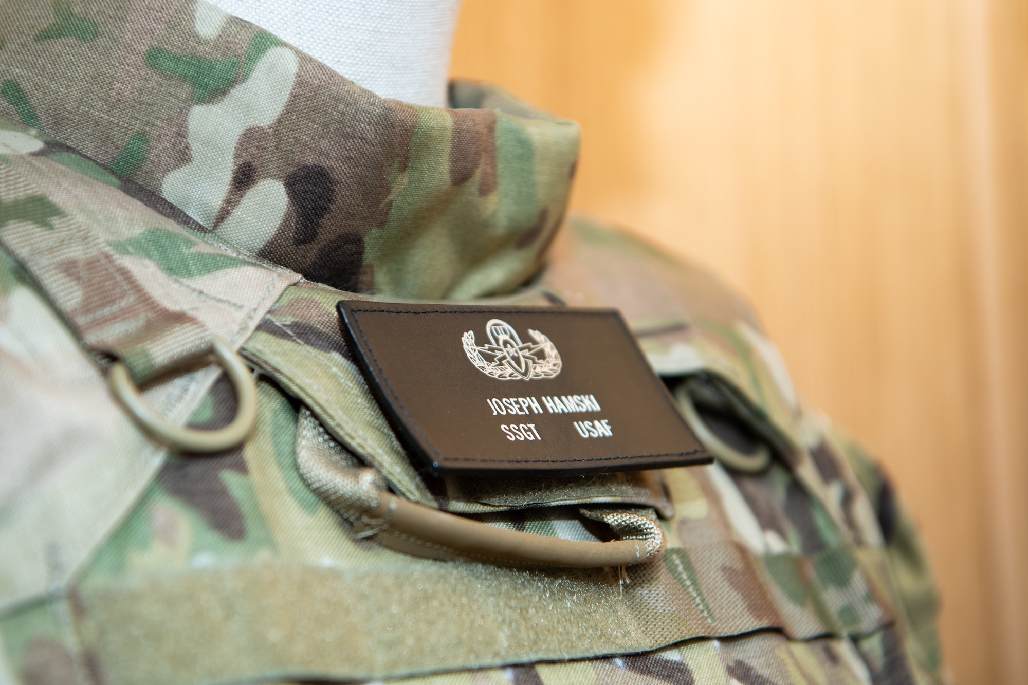 A display committed to the memory of U.S. Air Force Staff Sgt. Joseph J. Hamski greets visitors entering the 52nd Civil Engineer Squadron Explosive Ordnance Disposal flight facility at Spangdahlem Air Base, Germany, Dec. 1, 2023. The facility is dedicated to Hamski, an EOD technician who was assigned to Spangdahlem AB when he was killed in action in May 2011. (U.S. Air Force photo by Staff Sgt. Max J. Daigle)