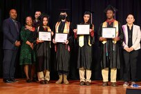 Cadets of the Capital Guardian Youth Challenge Academy Class 61 receive their diplomas upon completion of a 22 week long “quasi-military" course, during a residential phase commencement ceremony at the University of the District of Columbia, Dec. 29, 2023. Since 2013, the mission of the program is to intervene in and reclaim the lives of at-risk youth, and produce program graduates with the values, skills, education, and self-discipline necessary to succeed as adults.