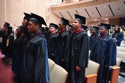Cadets of the Capital Guardian Youth Challenge Academy Class 61 receive their diplomas upon completion of a 22 week long “quasi-military" course, during a residential phase commencement ceremony at the University of the District of Columbia, Dec. 29, 2023. Since 2013, the mission of the program is to intervene in and reclaim the lives of at-risk youth, and produce program graduates with the values, skills, education, and self-discipline necessary to succeed as adults.