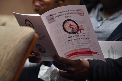 Cadets of the Capital Guardian Youth Challenge Academy Class 61 receive their diplomas upon completion of a 22 week long “quasi-military" course, during a residential phase commencement ceremony at the University of the District of Columbia, Dec. 29, 2023. Since 2013, the mission of the program is to intervene in and reclaim the lives of at-risk youth, and produce program graduates with the values, skills, education, and self-discipline necessary to succeed as adults.