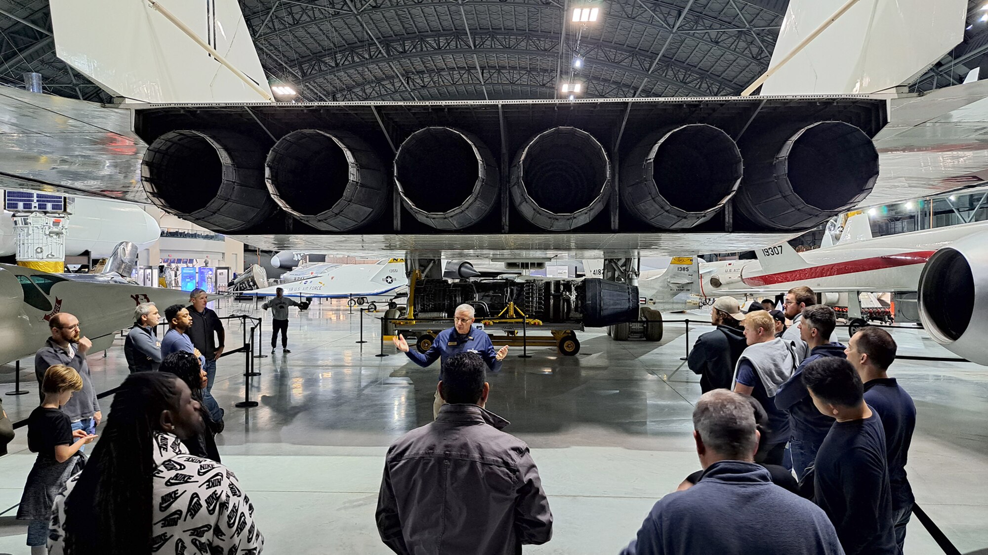 Group of people gathered around North American XB-70 Valkyrie engines.