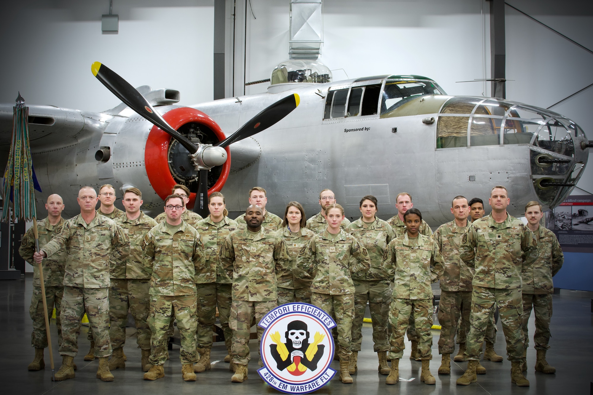 Members from the 428th Electromagnetic Warfare Flight pose in front of a B-25 Mitchell aircraft at Peterson Space Force Base, Colorado. The 428th EWF works alongside the U.S. Space Force’s 4th Electromagnetic Warfare Squadron in a total force integration readiness partnership to train, equip, mobilize and employ space electromagnetic warfare capabilities to support the full spectrum national security objectives. (Courtesy photo)