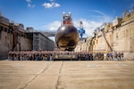USS Hawaii (SSN 776) Project Team poses for a group photo in the Pearl Harbor Naval Shipyard Dry Dock 1, Sept. 20, 2023.