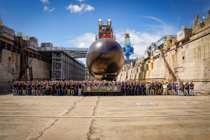 USS Hawaii (SSN 776) Project Team poses for a group photo in the Pearl Harbor Naval Shipyard Dry Dock 1